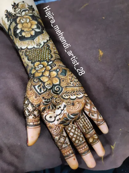 A single-arm view of a detailed design, showing the combination of floral, geometric, and paisley elements.