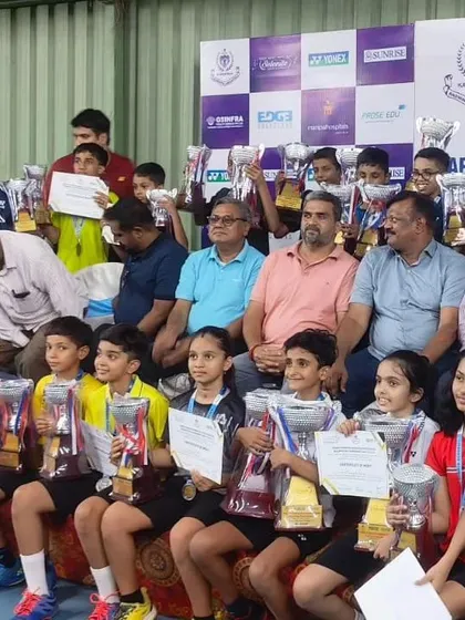 Celebrating with fellow competitors. Our trainee Pratham sits with other winners at the state ranking tournament, showcasing the spirit of sportsmanship we encourage in all our players.