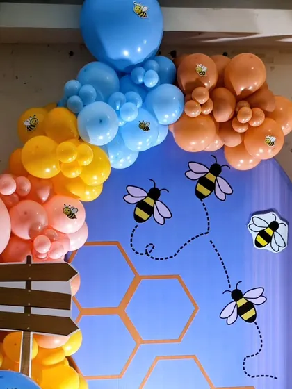 A detail shot of the honeybee backdrop with cute bee graphics.