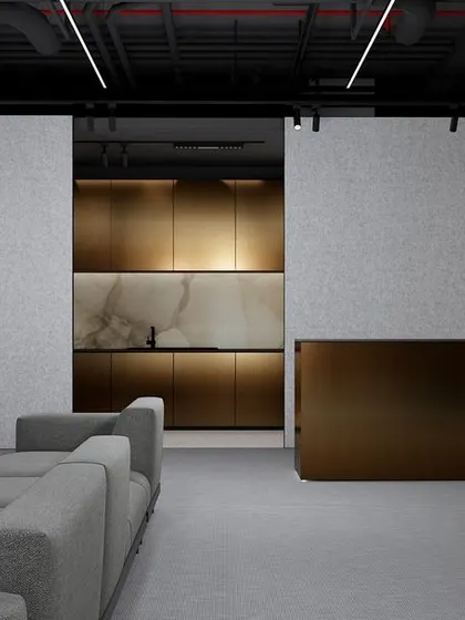 This lounge concept showcases a play of textures and tones, with a metallic bronze reception desk, soft grey seating, and felt-like wall panels. The exposed black ceiling adds an industrial edge, resulting in a space that feels ultra-modern and sophisticated.