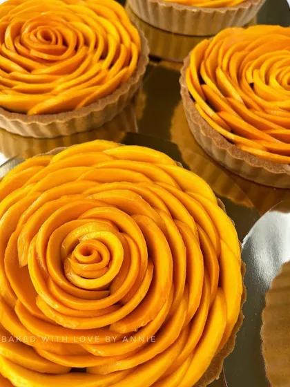 My Signature Chocolate Pudding Tart gets a seasonal makeover, topped with a beautiful rosette of thinly sliced fresh Alphonso mangoes. It's the perfect blend of rich chocolate and tropical sweetness.