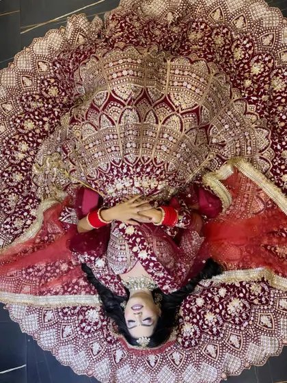 This is the kind of bridal magic I love to create. This shot captures the grandeur of a traditional wedding look, focusing on a flawless base, dramatic eyes, and a pose that makes the bride the absolute star of her day.