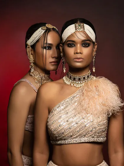 A close-up beauty shot from the same editorial, focusing on the synergy between the styling and makeup. The wet-look hair, smoky eyes, and layered pearl headbands were all part of my art direction to create a fierce and contemporary bridal look.