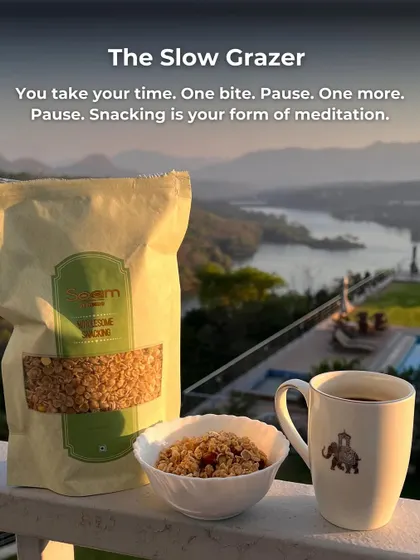 A serene scene of "The Slow Grazer" enjoying a bowl of my chivda with a cup of tea, overlooking a beautiful landscape. Snacking as a form of meditation.