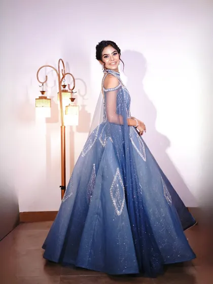 A smiling shot in the blue princess gown, showing how happy and confident you'll feel in it.