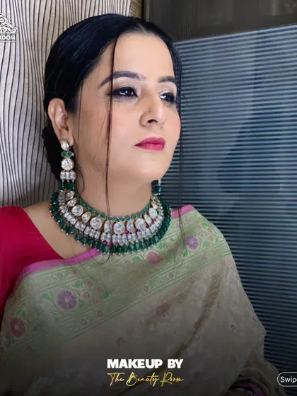 A side profile showing the clean lines of the makeup and how it enhances her features.
