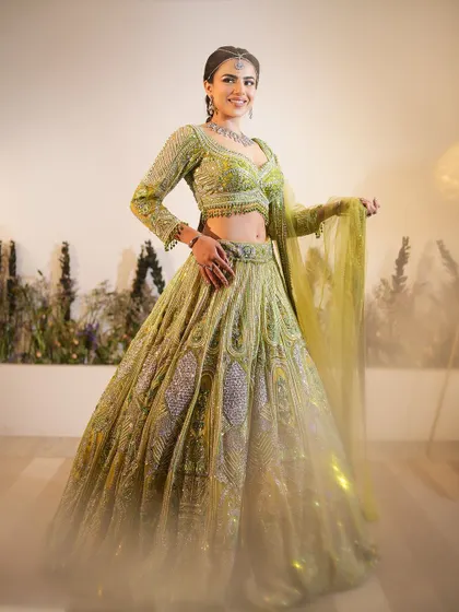 The full Mehendi look is a vision in green and yellow. The makeup is designed to complement the outfit beautifully.
