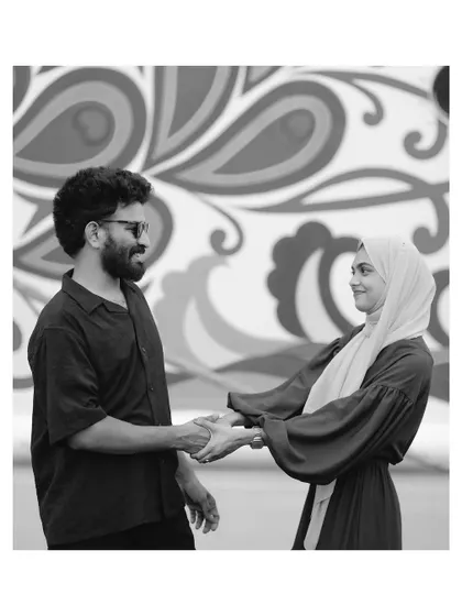 A timeless black and white portrait of a couple sharing a quiet moment. Removing color helps focus on the emotion and connection, creating a classic and artistic image from their pre-wedding session.