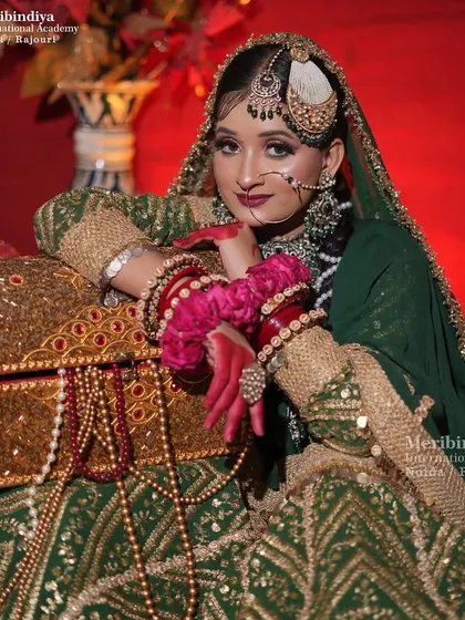 The complete royal look of a Muslim bride, with her hair styled to support the heavy dupatta and elaborate jewelry.