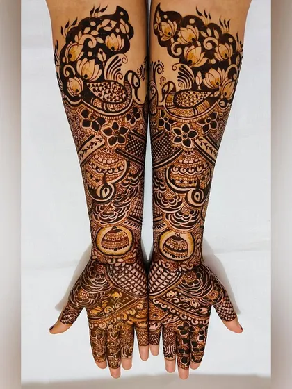 Another angle of the peacock and floral engagement design, showing the beautiful flow of the patterns on the arms.