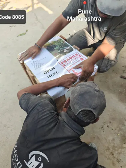 My team works on packing the natural rock fountain for its journey to Pune.