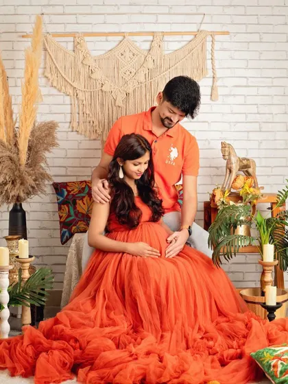 A tender moment captured between the couple, surrounded by the warm and earthy elements of the boho set.