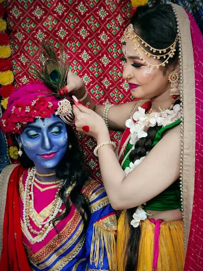 A behind-the-scenes moment from the Janmashtami shoot, showing Radha adjusting Krishna's 'mukut' (crown).