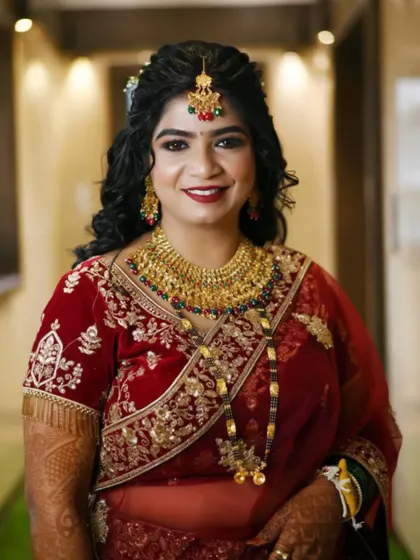 A full view of her stunning bridal attire. The makeup is kept classic and elegant to ensure her natural beauty shines through on her wedding day.
