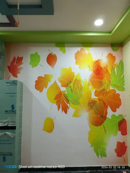 Another view of the colorful autumn leaves mural, showing its placement in a room.