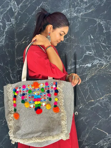 This bag is a piece of wearable art, showcasing traditional craftsmanship.