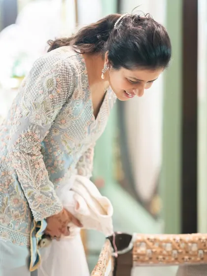 For my daughter Siya's half birthday, I wanted an outfit that was beautiful but also baby-friendly. I worked with a designer to create this custom Indo-Western tunic that was comfortable for carrying her.