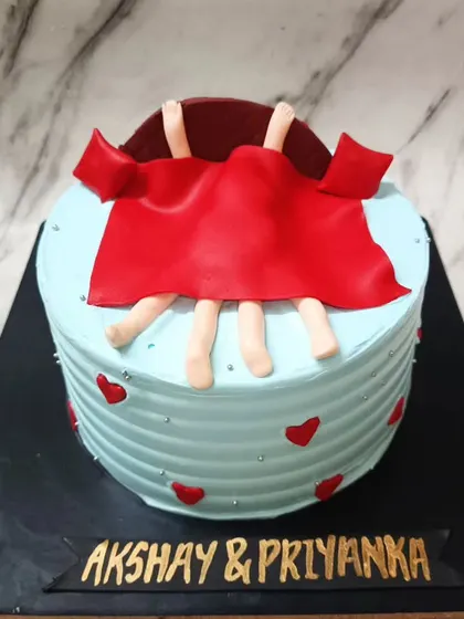 When love is in the air... and under the covers. 😉 A funny and naughty cake for a couple with a great sense of humor.
