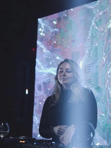 A moment of calm before the storm, standing in front of a cosmic visual display before my set begins.