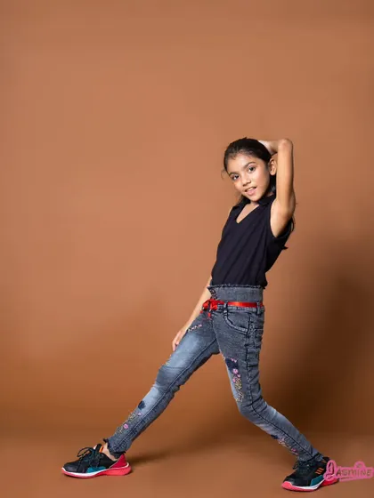 A stylish and confident pose from the girls' jeans campaign. This shows that kids' fashion can be both fun and trendy.