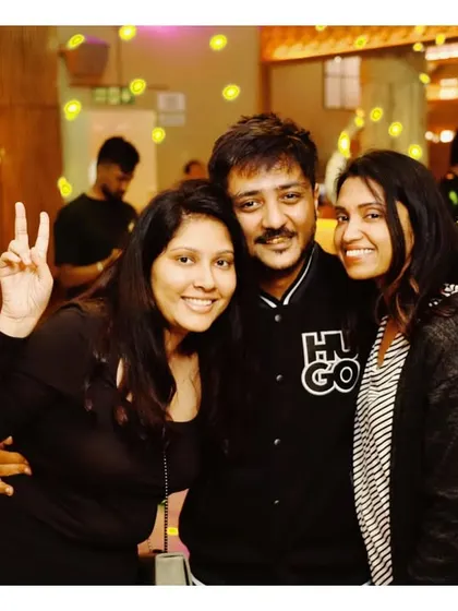 Friends posing for a photo, enjoying the fun atmosphere at Social.
