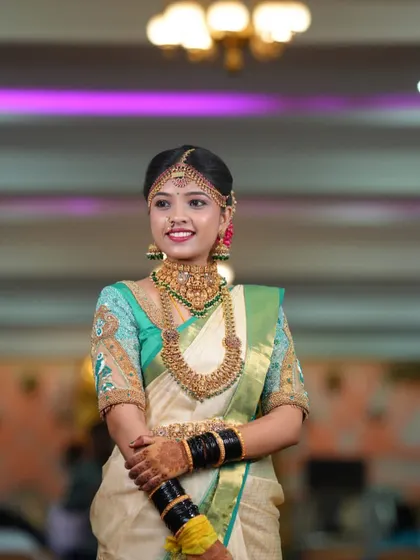 Our beautiful bride Gowthami, looking serene and elegant in her custom designed off-white and green silk saree and blouse for her wedding.