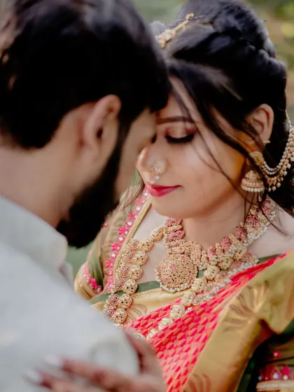 A close-up shot that emphasizes the emotion and the details. You can see the bride's stunning jewelry and the groom's loving gaze, creating a powerful and intimate portrait.