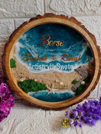 Your home's story begins at the door. This personalized ocean-themed nameplate, set in a rustic wood slice, combines the calm of the sea with the warmth of family, featuring real sand, shells, and beautiful 3D waves.