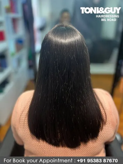 A beautiful after shot of a keratin treatment. The hair is perfectly straight, reflecting the light and showing off its healthy, nourished condition from root to tip.