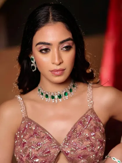 A close-up of the soft glam cocktail look. The focus is on the shimmery pink eyeshadow and glossy lips, creating a look that is both dazzling and sophisticated.