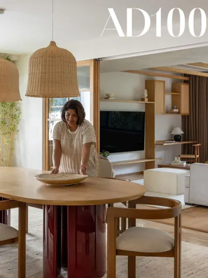 Me, styling the dining table for our AD100 photoshoot. Every detail matters in bringing a space to life.