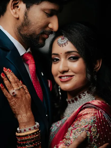 A close-up portrait of the bride, her smile and eyes sparkling with happiness.