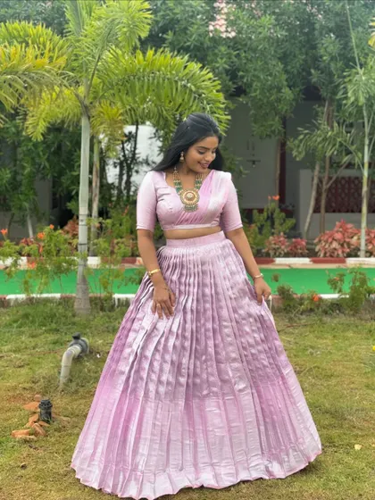 The client looking graceful in her custom lavender Langa Dhawani, a perfect outfit for daytime events.