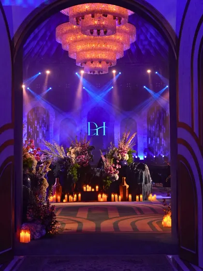 The grand entrance to our 'Shaam Sufiana'. We transformed a space with layers of blue, dramatic lighting, and countless candles to create a soul-stirring atmosphere for an evening of Sufi music.