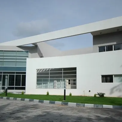 A perspective of the building's exterior, showing the careful composition of its architectural massing. The large window cutouts and overlapping planes give the structure a dynamic and contemporary feel.