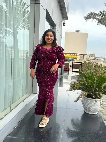 A happy, smiling shot in the magenta gown. My style is all about celebrating life and feeling good.