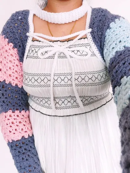 A close-up of the front lacing and the choker collar of the Gaea Shrug.