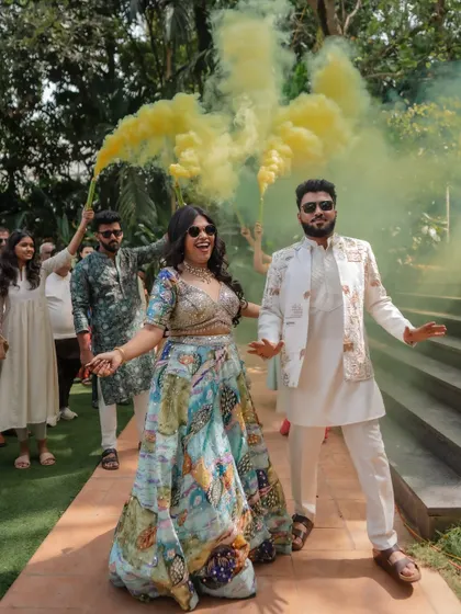 The energy of the baraat and pre-wedding festivities is infectious. We capture the couple and their friends dancing, playing games, and celebrating with pure, uninhibited joy.