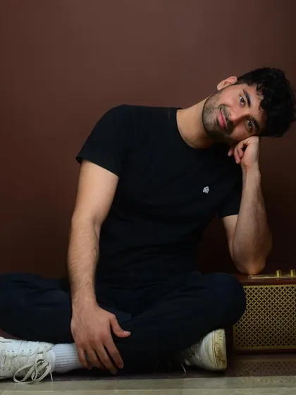 A relaxed, floor-seated pose. This casual and approachable shot adds another dimension to a portfolio, showing a comfortable and easygoing side.