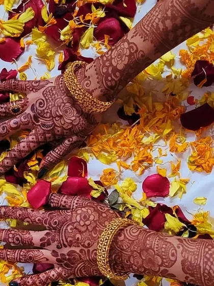 This photo, taken on a bed of flower petals, showcases the gorgeous, dark stain of the henna. The color is deep and vibrant, a testament to the quality of the organic paste I use.