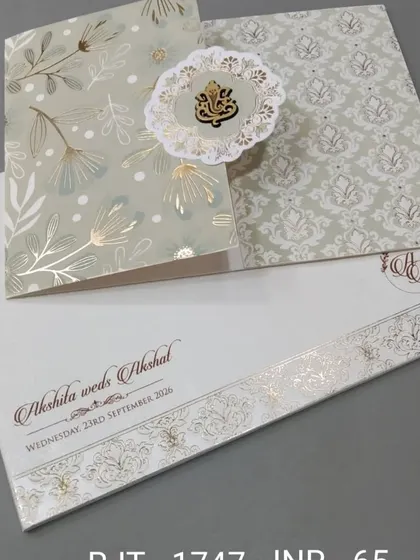 This simple and elegant card features a Ganesha emblem on a pop-out floral medallion. The design is clean, with gold foil accents for a touch of grace.