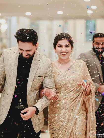 Pure joy captured as the couple is showered with confetti. These high-energy, candid shots are full of life.