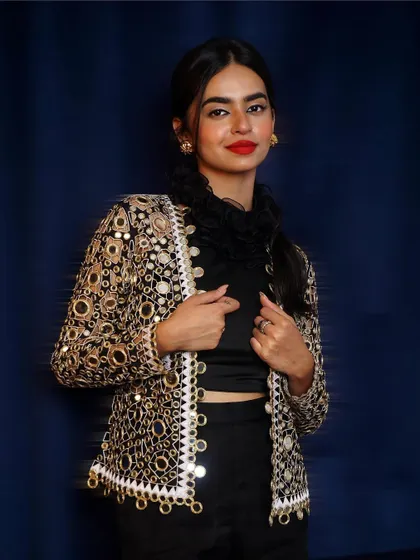 Adding a stunning, heavily embellished mirror-work jacket to the look. This shot shows how to style a single base outfit in multiple ways for a lookbook.