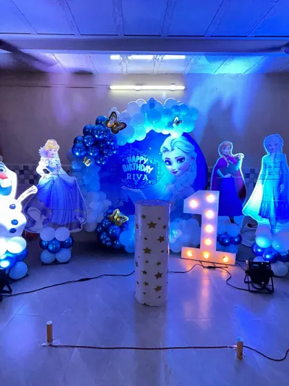 Another view of the illuminated 'Frozen' party, showing how the blue lighting and glowing characters create a truly immersive winter wonderland experience.