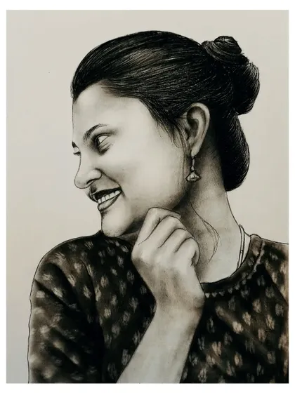 A candid-style charcoal portrait of a smiling woman. The detailed shading on her face and hair bun showcases the realism of my sketch work.