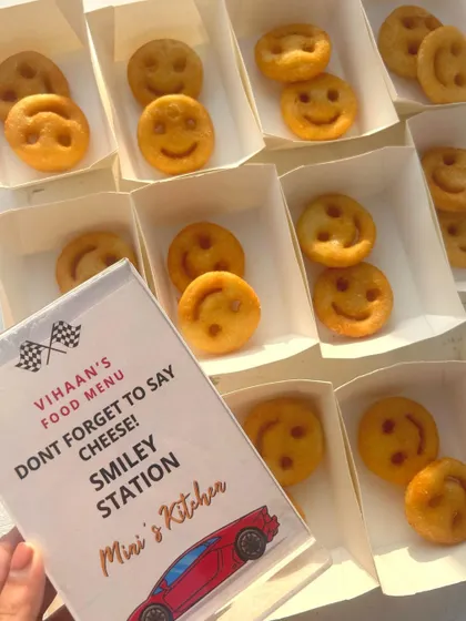 "Don't forget to say cheese!" A fun, car-themed menu card for the Smiley Station at Vihaan's birthday party. The little details make all the difference.