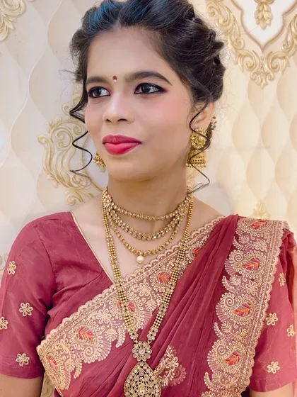 The full look of the client in the maroon saree, looking elegant and ready for a wedding.