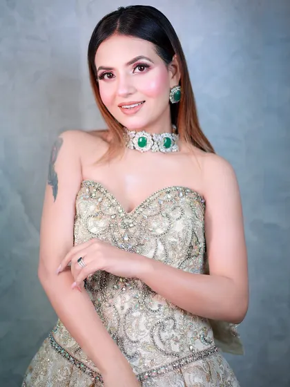 A smiling portrait in a beautiful strapless gown, showcasing a glamorous evening look.