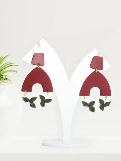 Festive-themed clay earrings, shot in our studio. This image is perfect for seasonal marketing campaigns and holiday gift guides.