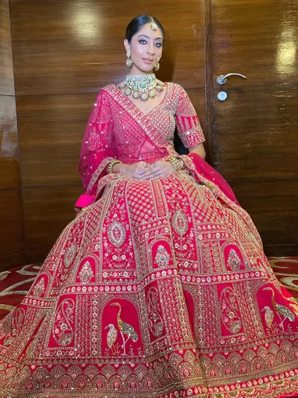The complete royal look. The makeup, hair, and outfit all work in harmony to create a breathtaking vision of a modern Indian bride.